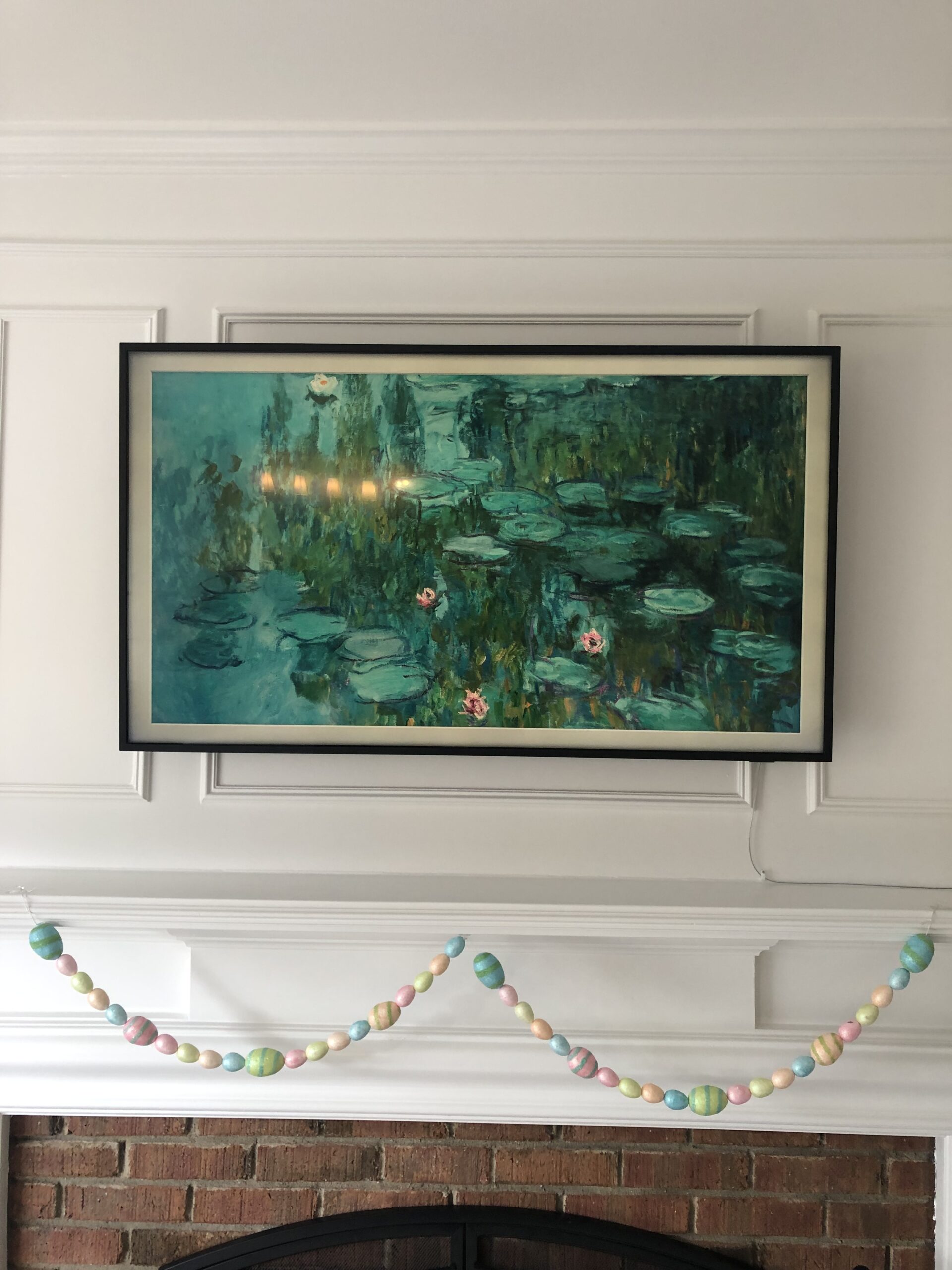 Samsung Frame TV mounted above a fireplace
